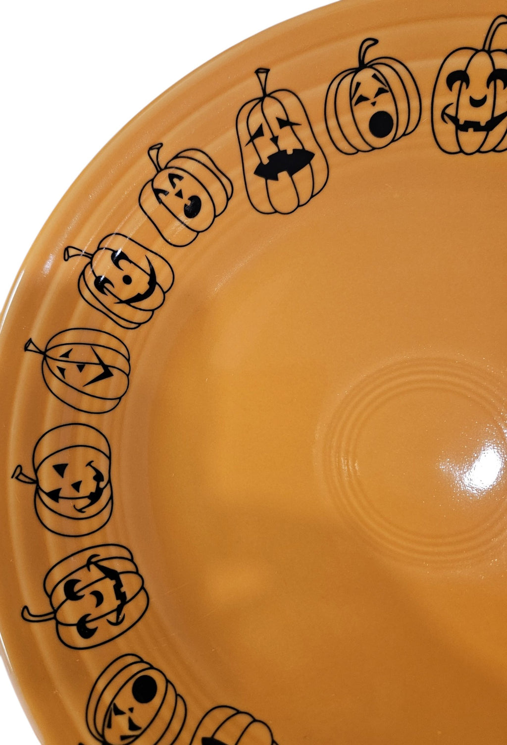 This is a Fiesta fiestaware Classic Luncheon Plate featuring the Carson's Exclusive Jack O' Lanterns decal on tangerine. Lead free, Post 1986 retired decal, retired color, Halloween
