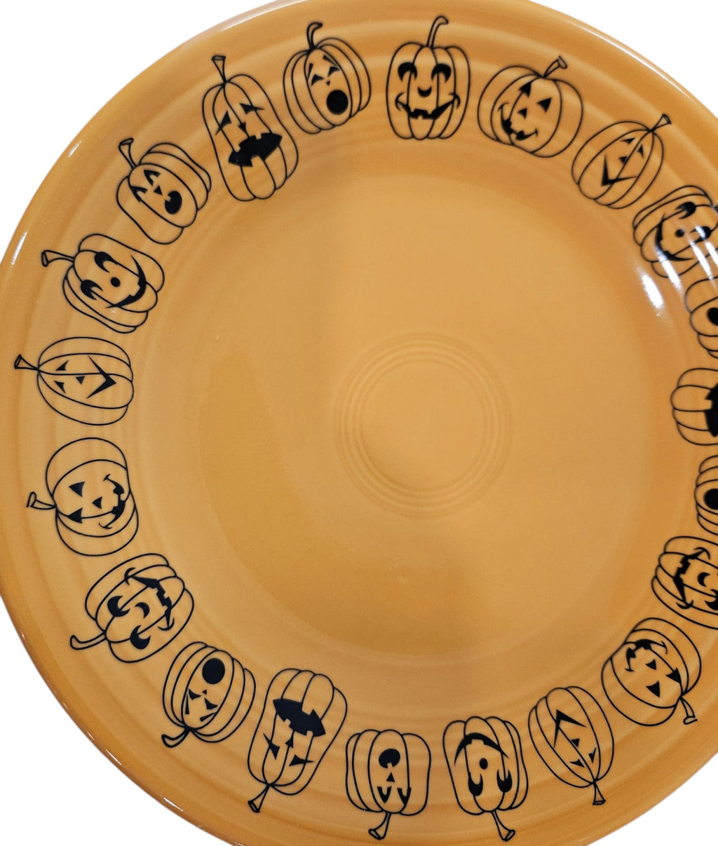 This is a Fiesta fiestaware Classic Luncheon Plate featuring the Carson's Exclusive Jack O' Lanterns decal on tangerine. Lead free, Post 1986 retired decal, retired color, Halloween
