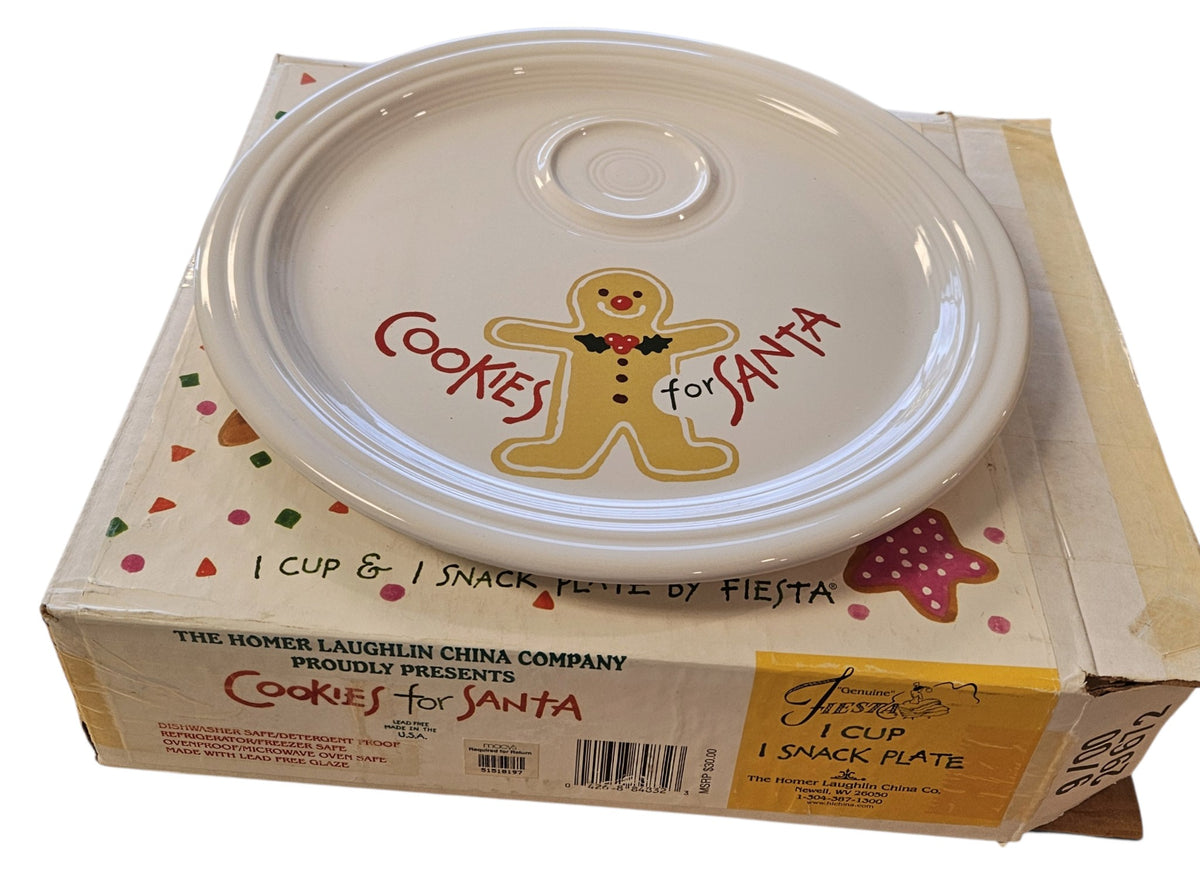 This is a Fiesta Fiestaware Welled Snack Plate and Cup featuring Betty Crocker's original Cookies for Santa Gingerbread decal on White. Post 1986, Lead-free, Decorated, Retired Decal, Christmas. The set went under General Release after Betty Crocker shut down their catalog. The set comes with the original box and packaging.
