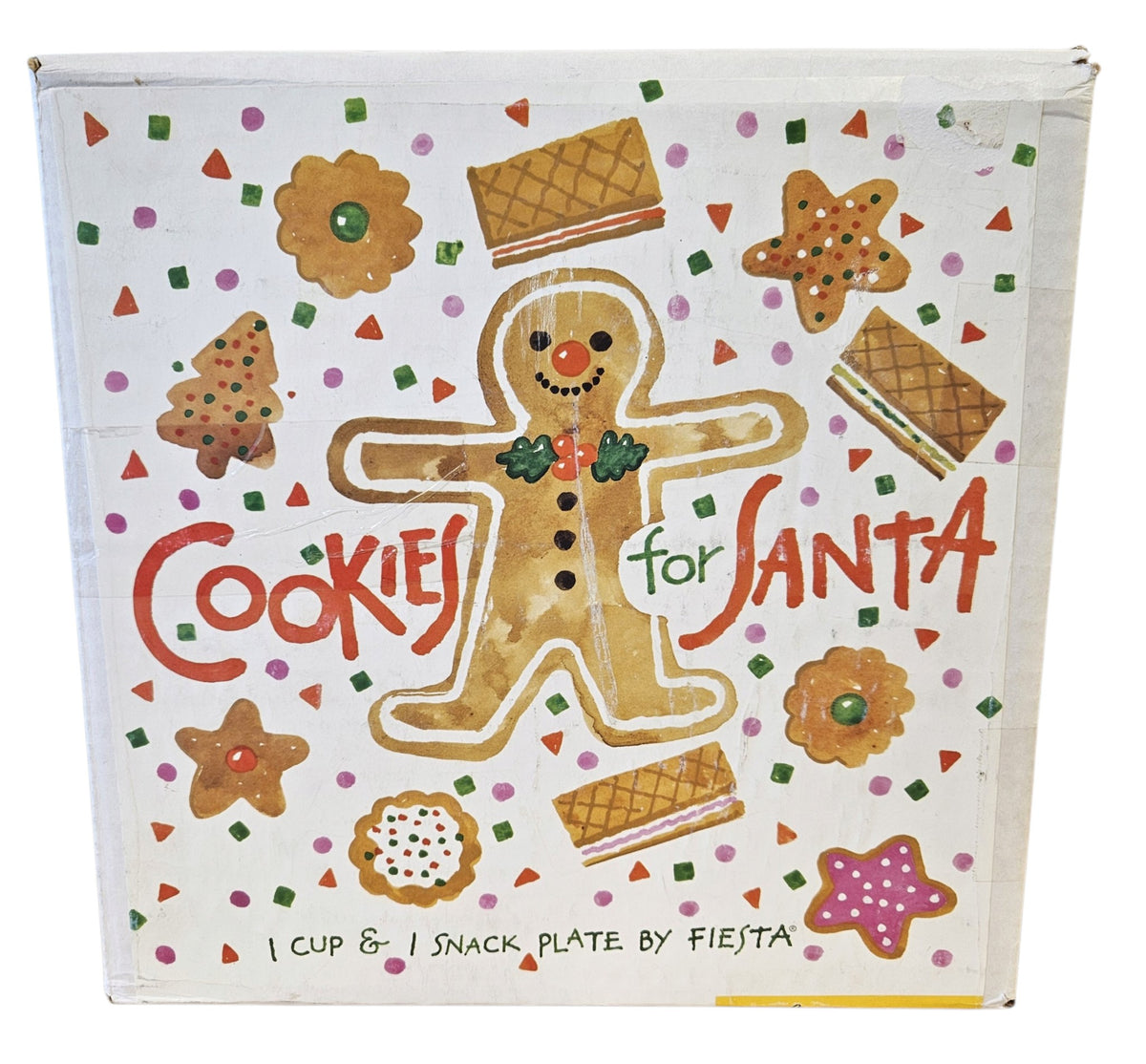 This is a Fiesta Fiestaware Welled Snack Plate and Cup featuring Betty Crocker's original Cookies for Santa Gingerbread decal on White. Post 1986, Lead-free, Decorated, Retired Decal, Christmas. The set went under General Release after Betty Crocker shut down their catalog. The set comes with the original box and packaging.
