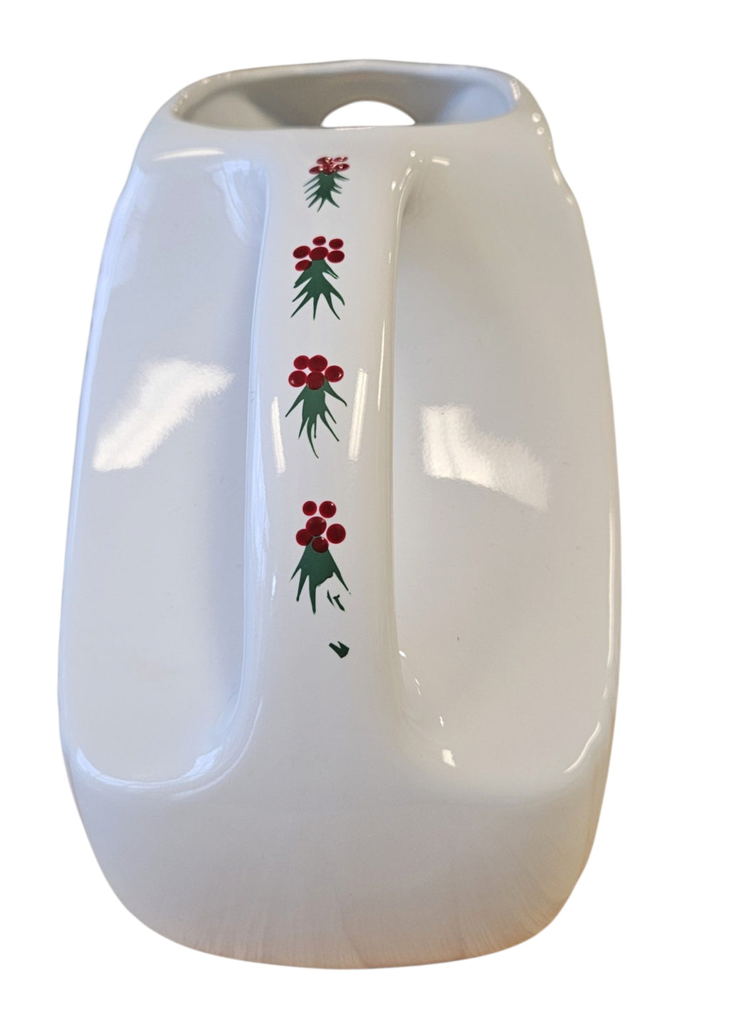 This is a Fiesta Fiestaware Large Disk Pitcher featuring hand-painted artwork by Patricia Degraw on white. The artwork is reflective of Christmas and the Holidays with reds and greens paint hues, holly and berries and a partial mandala pattern. Decorated, Post-1986, Lead-Free
