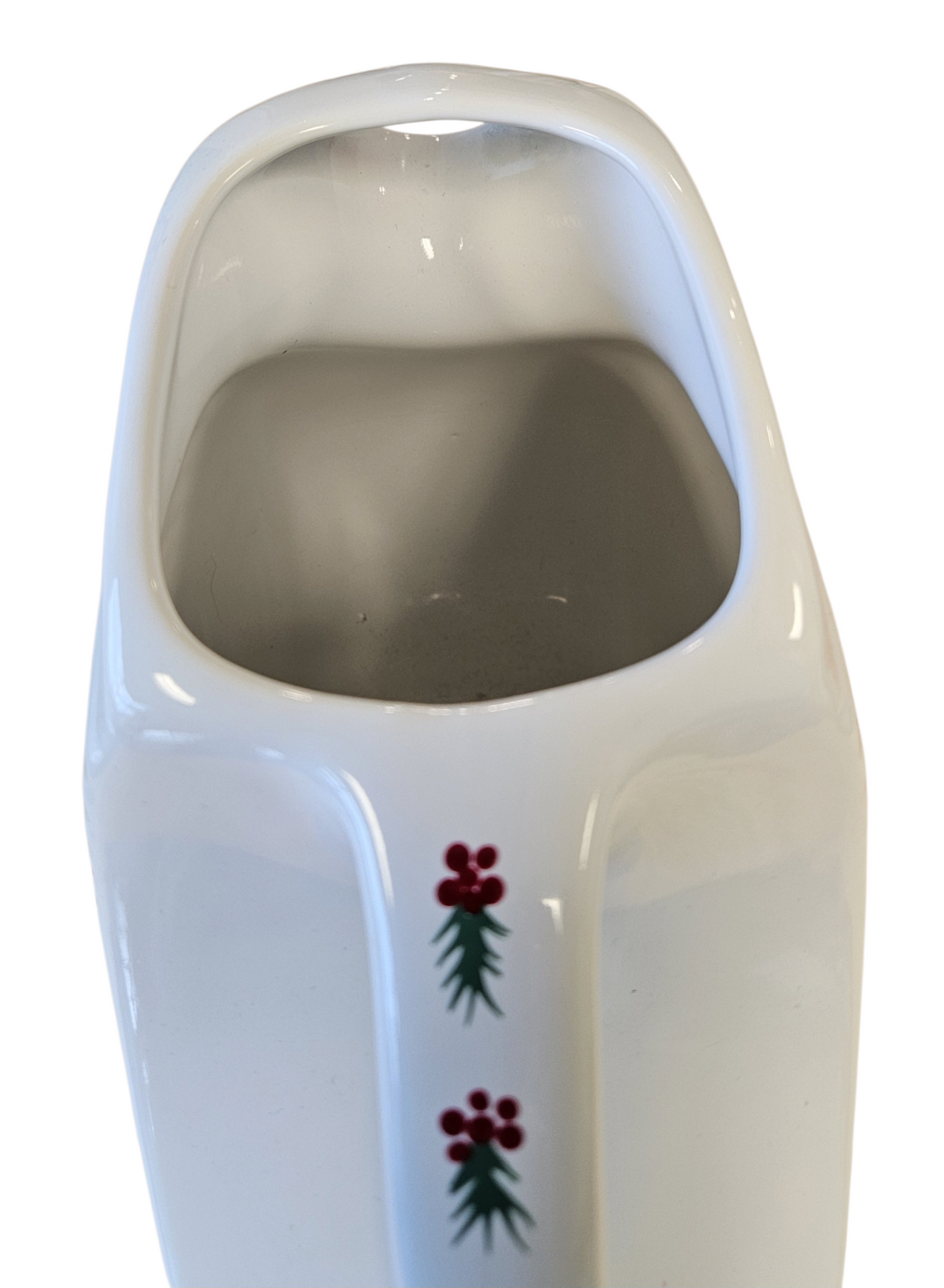 This is a Fiesta Fiestaware Large Disk Pitcher featuring hand-painted artwork by Patricia Degraw on white. The artwork is reflective of Christmas and the Holidays with reds and greens paint hues, holly and berries and a partial mandala pattern. Decorated, Post-1986, Lead-Free
