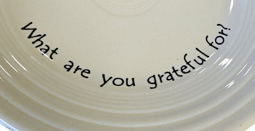 This is a Fiesta Fiestaware Classic Luncheon Plate featuring Fiesta's exclusive Café Gratitude "What are you Gratefuk For?" decal  on Ivory. The decal was created as a conversation or "pass along" piece to encourage reflection and gratitude during meals. Post 1986, Lead-free, Thanksgiving, Fall, Christmas, Decorated, Retired Decal
