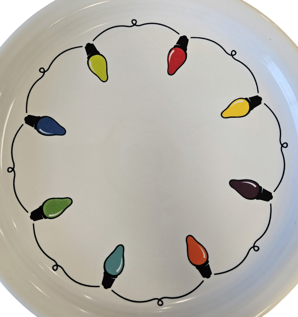 This is a Fiesta Fiestaware Bistro Luncheon Plate featuring the decal sometimes called Bon-Ton's Christmas Lights, String of Lights, or Holiday Lights on White. Post 1986, Lead-free, Christmas, Tree, Decorated, Retired Decal
