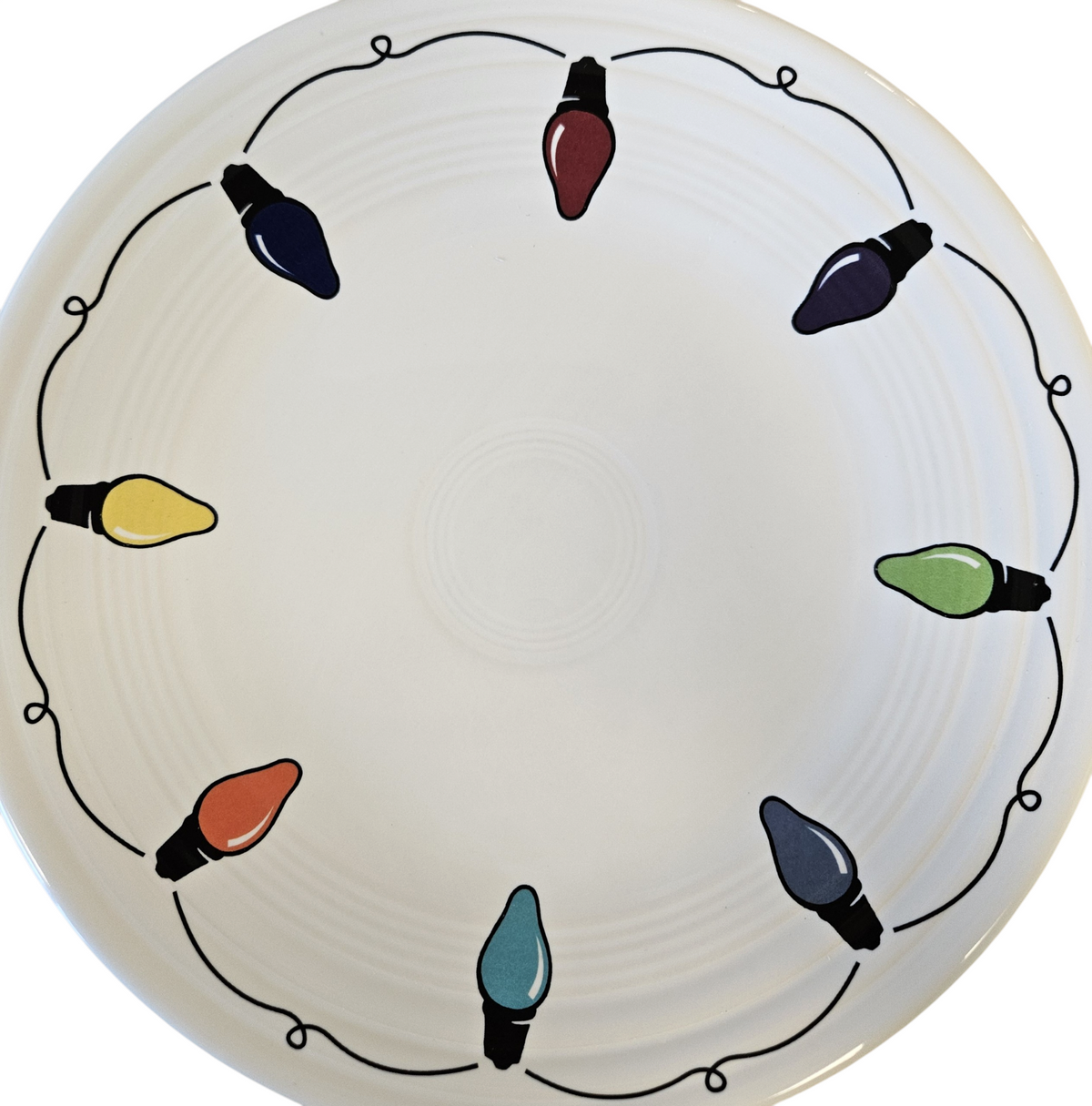 This is a Fiesta Fiestaware Classic Luncheon Plate featuring the decal sometimes called Bon-Ton's Christmas Lights, String of Lights, or Holiday Lights on White. Post 1986, Lead-free, Christmas, Tree, Decorated, Retired Decal
