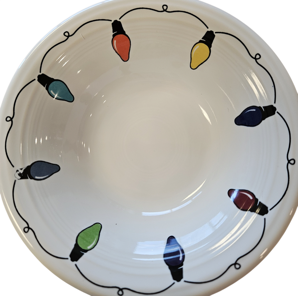 This is a Fiesta Fiestaware Stacking Ceral Bowl featuring the decal sometimes called Bon-Ton's Christmas Lights, String of Lights, or Holiday Lights on White. Post 1986, Lead-free, Christmas, Tree, Decorated, Retired Decal
