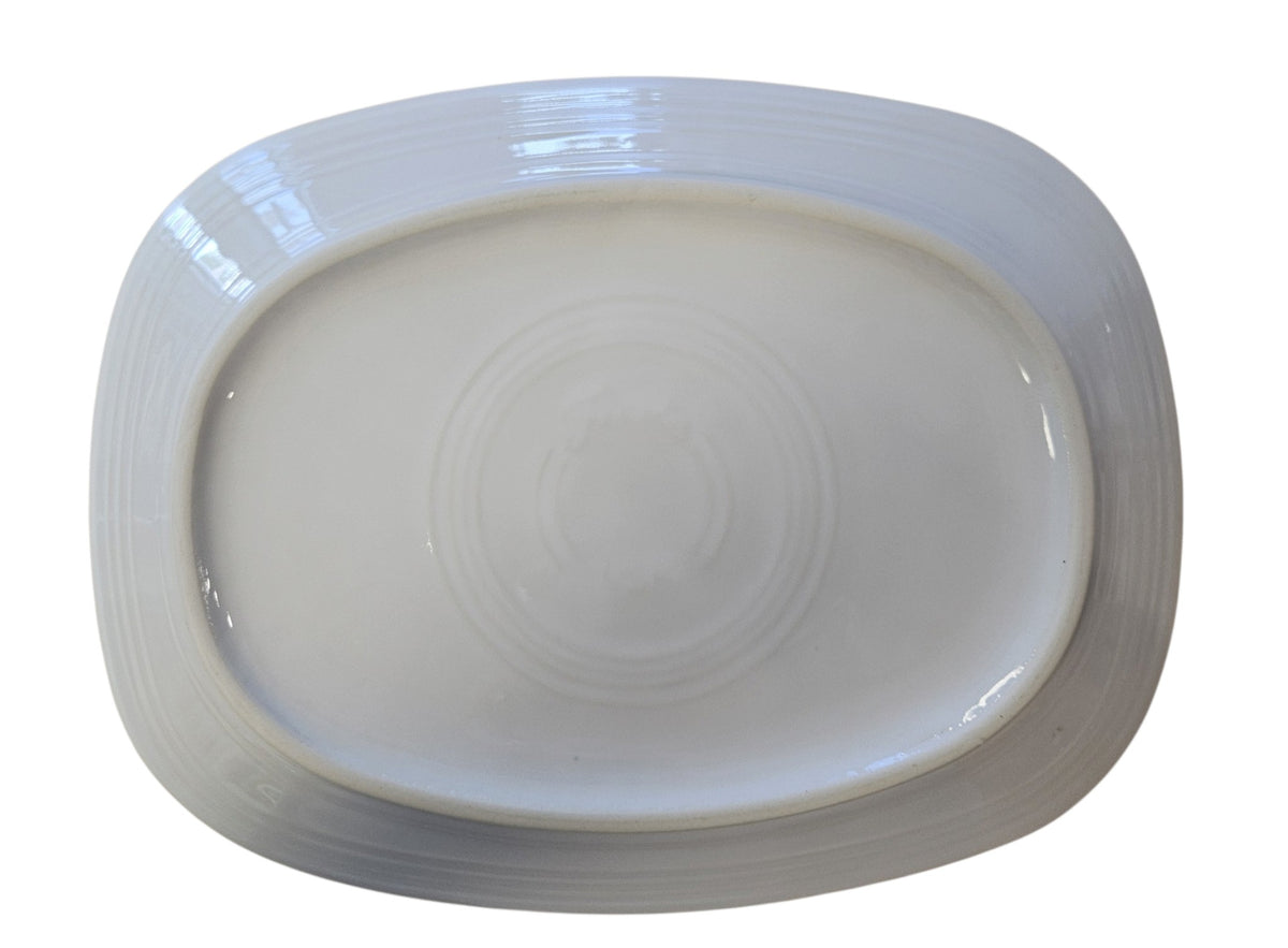 This is a Fiesta Fiestaware Rectangular Platter featuring the Snow Couple decal on White. Post 1986, Lead-free, Decorated, Christmas
