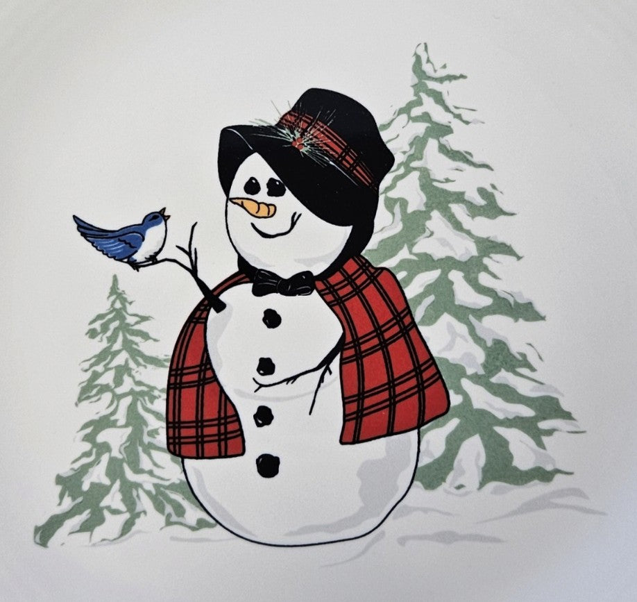 This is a Fiesta Fiestaware Classic Luncheon Plate featuring the Snowlady decal on White. Post 1986, Lead-free, Decorated, Christmas
