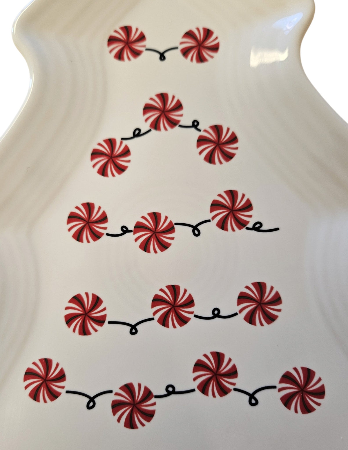 This is a Fiesta Fiestaware Tree Shaped Plate featuring FTCCO's Peppermint decal on White. Post 1986, Lead-free, Decorated, Christmas, Original Betty Crocker Peppermint decal brought back to life by FTCCO.
