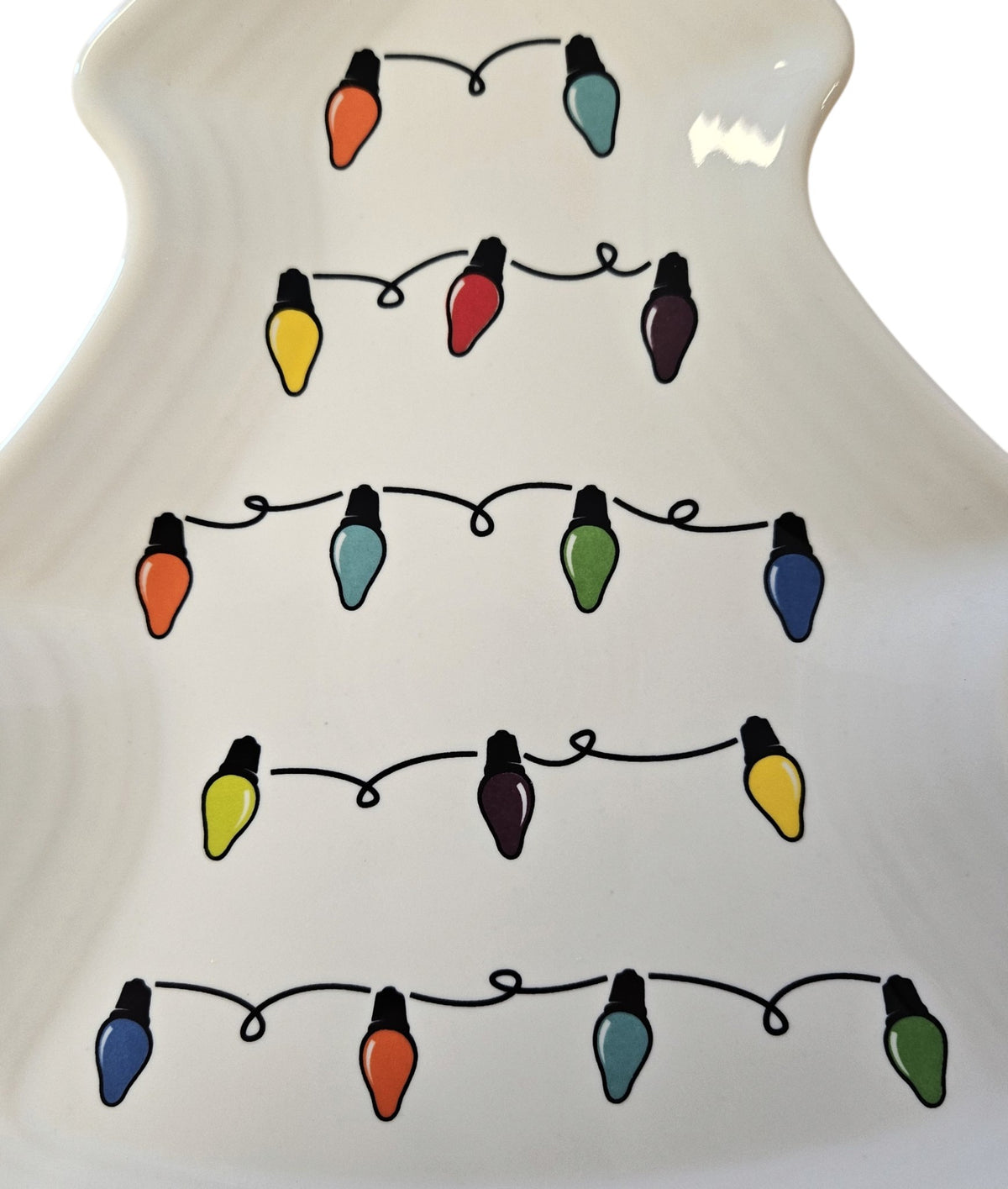 This is a Fiesta Fiestaware Tree Shaped Plate featuring the decal sometimes called Bon-Ton's Christmas Lights, String of Lights, or Holiday Lights on White. Post 1986, Lead-free, Christmas, Tree, Decorated, Retired Decal
