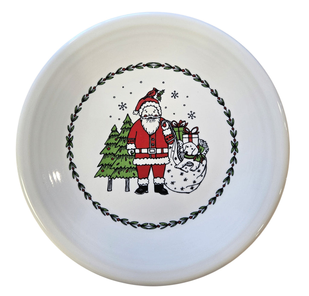 This is a Fiesta Fiestaware Classic Salad Plate featuring Everything Kitchen's exclusive Christmas Whimsey decal  on White. Post 1986, Lead-free, Christmas, Tree, Decorated, Retired Decal, Santa, Gift Bag
