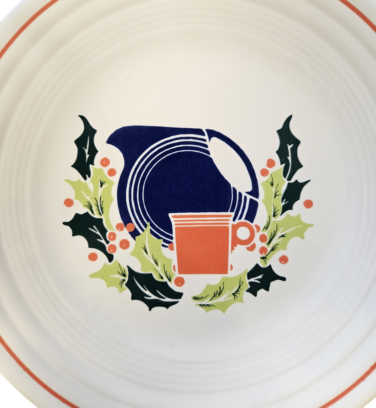 This is a Fiesta Fiestaware Classic Luncheon Plate featuring Federated Department Store's Christmas decal on White. Post 1986, Lead-free, Decorated, Retired Decal, Christmas, Disk Pitcher, Ring Handled Mug, Greenery

