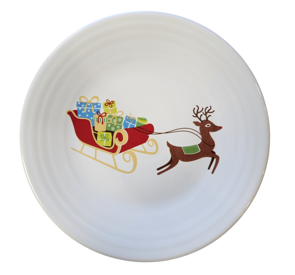 This is a Fiesta Fiestaware Classic Luncheon Plate featuring the Belk's Holiday Sleigh decal on White. Post 1986, Lead-free, Christmas, Sleigh, Reindeer, Decorated, Retired Decal
