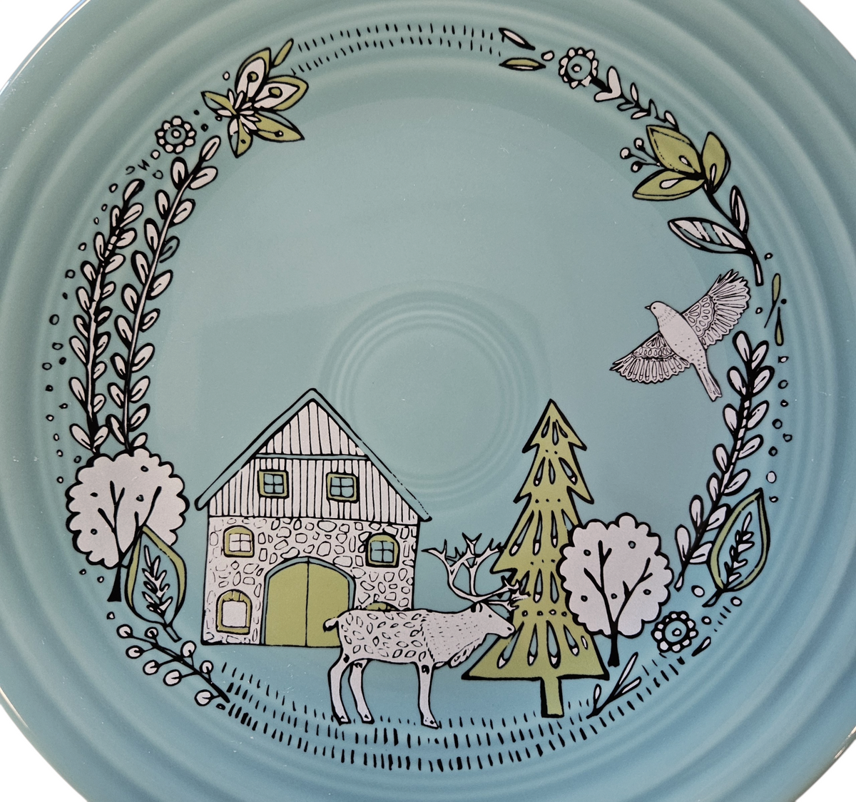 This is a Fiesta Fiestaware Classic Luncheon Plate featuring Everything Kitchen's exclusive Nordic Woodland decal  on Turquoise. Scandinavian, Post 1986, Lead-free, Christmas, Tree, Decorated, Retired Decal, Cabin, Reindeer, Trees

