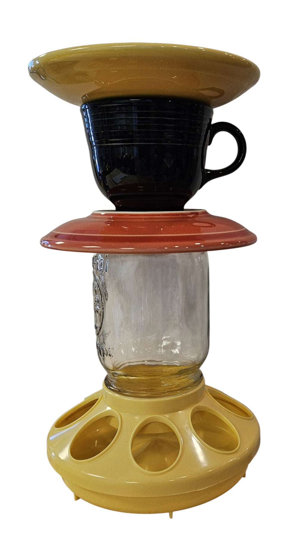 This is a handcrafted Birdfeeder made from a Fiesta Fiestware Cup and two saucers. It includes a glass jar to hold birdseed and either a plastic or metal base for the birds to land and feast. The top saucer is also perfect to hold grape jam or orange slices to feed your local orioles. Please see item description for specific cup and saucer color, jar color and base type. Crafted, Fiesta Second Life
