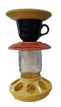 This is a handcrafted Birdfeeder made from a Fiesta Fiestware Cup and two saucers. It includes a glass jar to hold birdseed and either a plastic or metal base for the birds to land and feast. The top saucer is also perfect to hold grape jam or orange slices to feed your local orioles. Please see item description for specific cup and saucer color, jar color and base type. Crafted, Fiesta Second Life
