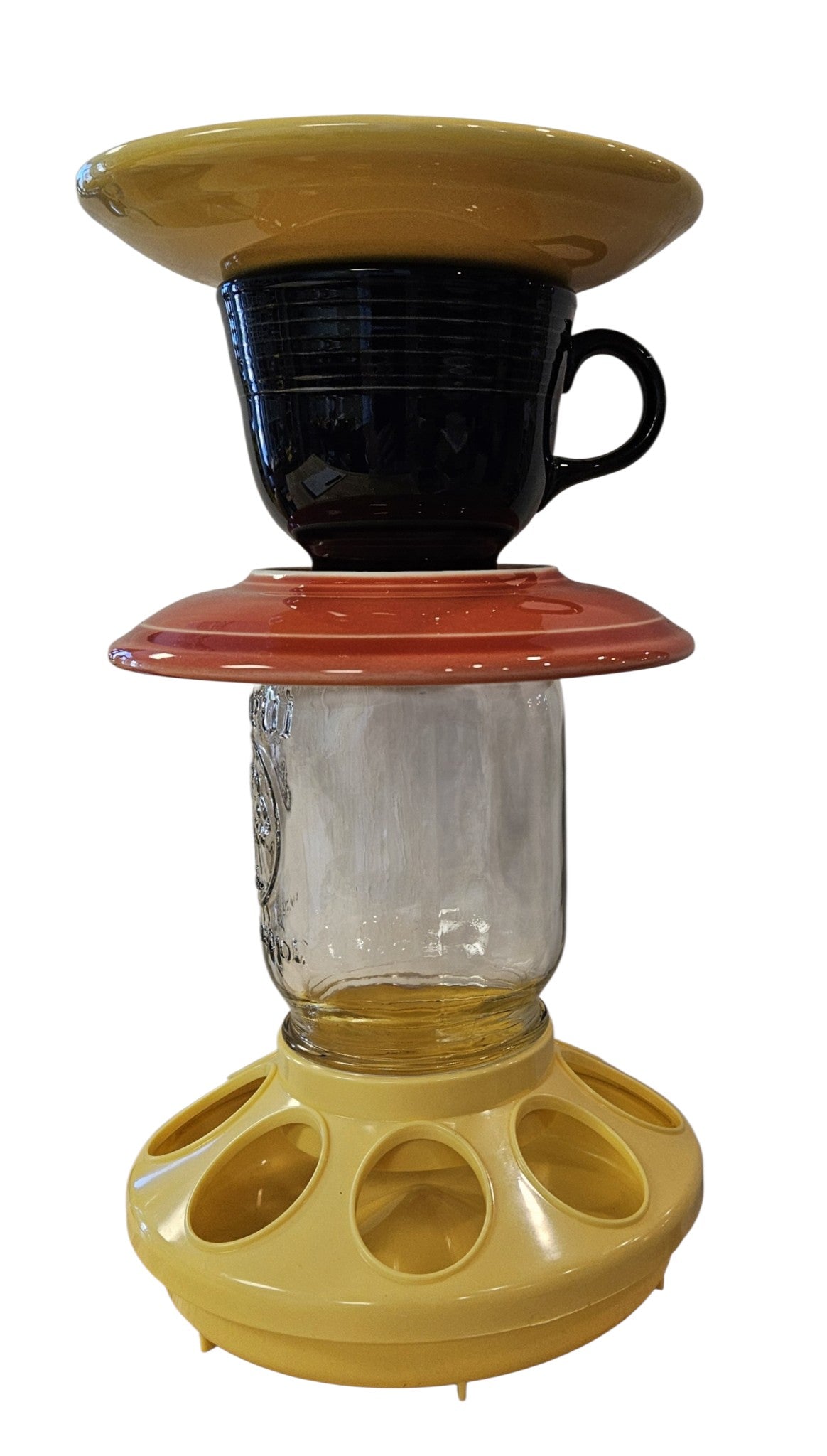 This is a handcrafted Birdfeeder made from a Fiesta Fiestware Cup and two saucers. It includes a glass jar to hold birdseed and either a plastic or metal base for the birds to land and feast. The top saucer is also perfect to hold grape jam or orange slices to feed your local orioles. Please see item description for specific cup and saucer color, jar color and base type. Crafted, Fiesta Second Life
