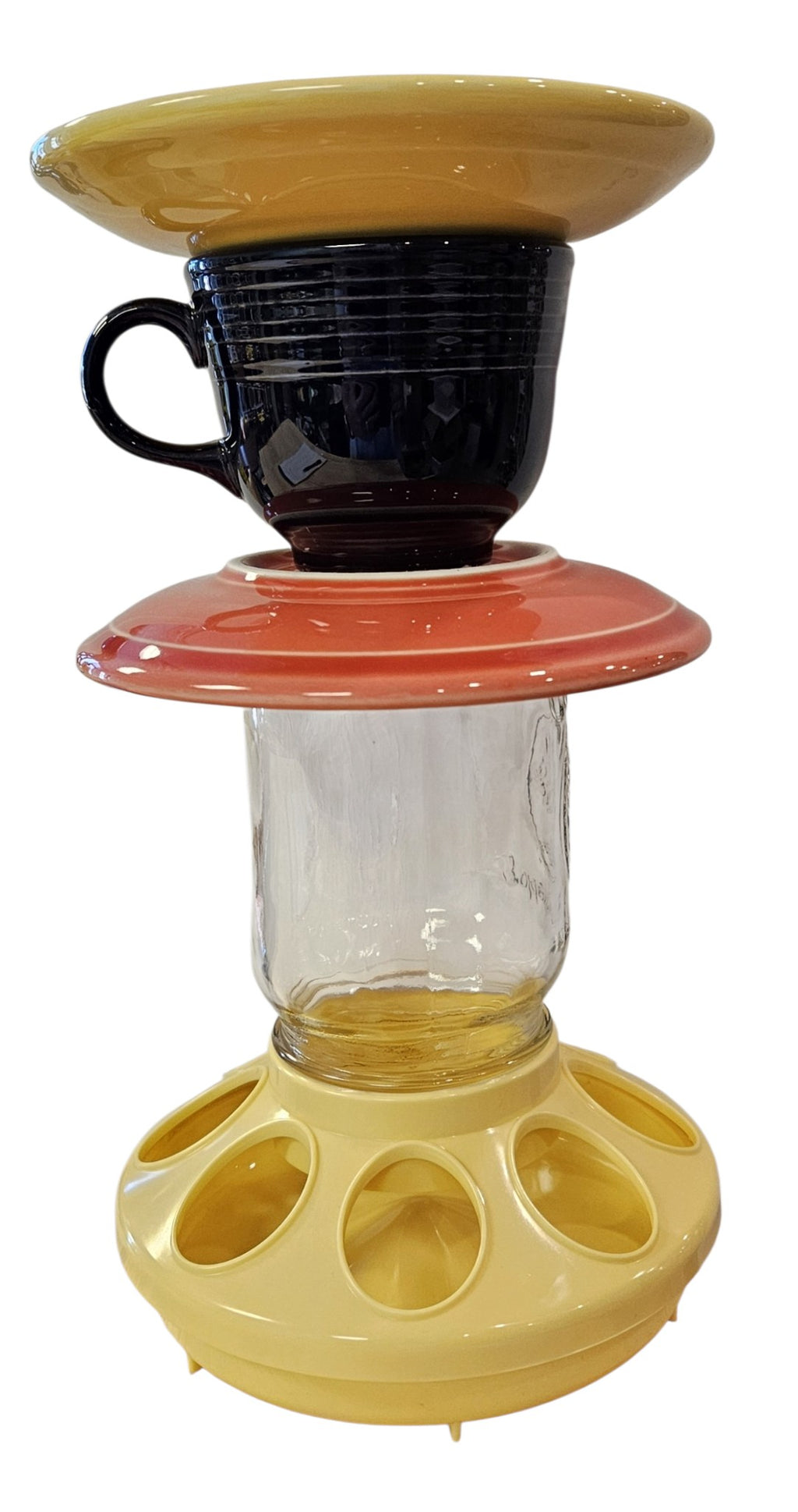 This is a handcrafted Birdfeeder made from a Fiesta Fiestware Cup and two saucers. It includes a glass jar to hold birdseed and either a plastic or metal base for the birds to land and feast. The top saucer is also perfect to hold grape jam or orange slices to feed your local orioles. Please see item description for specific cup and saucer color, jar color and base type. Crafted, Fiesta Second Life
