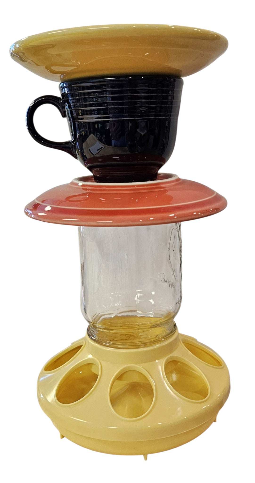 This is a handcrafted Birdfeeder made from a Fiesta Fiestware Cup and two saucers. It includes a glass jar to hold birdseed and either a plastic or metal base for the birds to land and feast. The top saucer is also perfect to hold grape jam or orange slices to feed your local orioles. Please see item description for specific cup and saucer color, jar color and base type. Crafted, Fiesta Second Life

