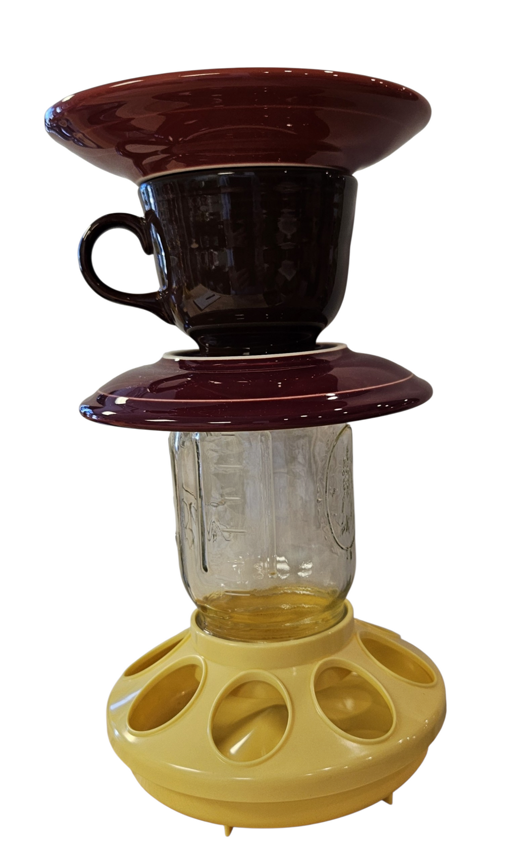 This is a handcrafted Birdfeeder made from a Fiesta Fiestware Cup and two saucers. It includes a glass jar to hold birdseed and either a plastic or metal base for the birds to land and feast. The top saucer is also perfect to hold grape jam or orange slices to feed your local orioles. Please see item description for specific cup and saucer color, jar color and base type. Crafted, Fiesta Second Life
