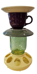 This is a handcrafted Birdfeeder made from a Fiesta Fiestware Cup and two saucers. It includes a glass jar to hold birdseed and either a plastic or metal base for the birds to land and feast. The top saucer is also perfect to hold grape jam or orange slices to feed your local orioles. Please see item description for specific cup and saucer color, jar color and base type. Crafted, Fiesta Second Life
