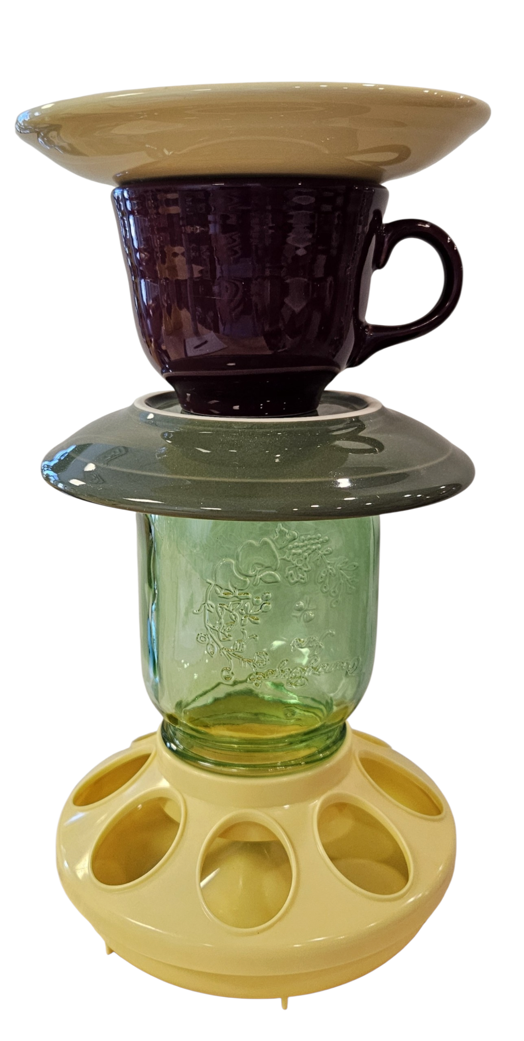 This is a handcrafted Birdfeeder made from a Fiesta Fiestware Cup and two saucers. It includes a glass jar to hold birdseed and either a plastic or metal base for the birds to land and feast. The top saucer is also perfect to hold grape jam or orange slices to feed your local orioles. Please see item description for specific cup and saucer color, jar color and base type. Crafted, Fiesta Second Life
