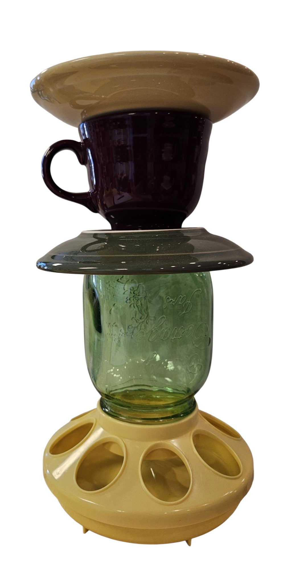 This is a handcrafted Birdfeeder made from a Fiesta Fiestware Cup and two saucers. It includes a glass jar to hold birdseed and either a plastic or metal base for the birds to land and feast. The top saucer is also perfect to hold grape jam or orange slices to feed your local orioles. Please see item description for specific cup and saucer color, jar color and base type. Crafted, Fiesta Second Life
