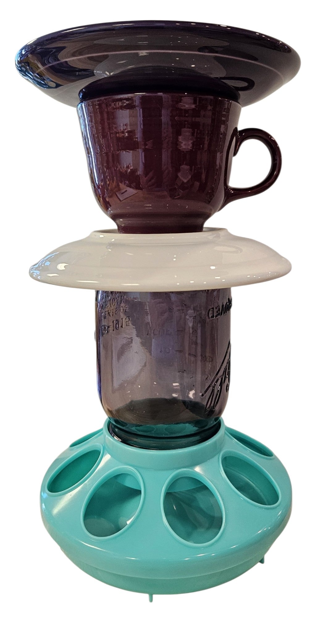 This is a handcrafted Birdfeeder made from a Fiesta Fiestware Cup and two saucers. It includes a glass jar to hold birdseed and either a plastic or metal base for the birds to land and feast. The top saucer is also perfect to hold grape jam or orange slices to feed your local orioles. Please see item description for specific cup and saucer color, jar color and base type. Crafted, Fiesta Second Life
