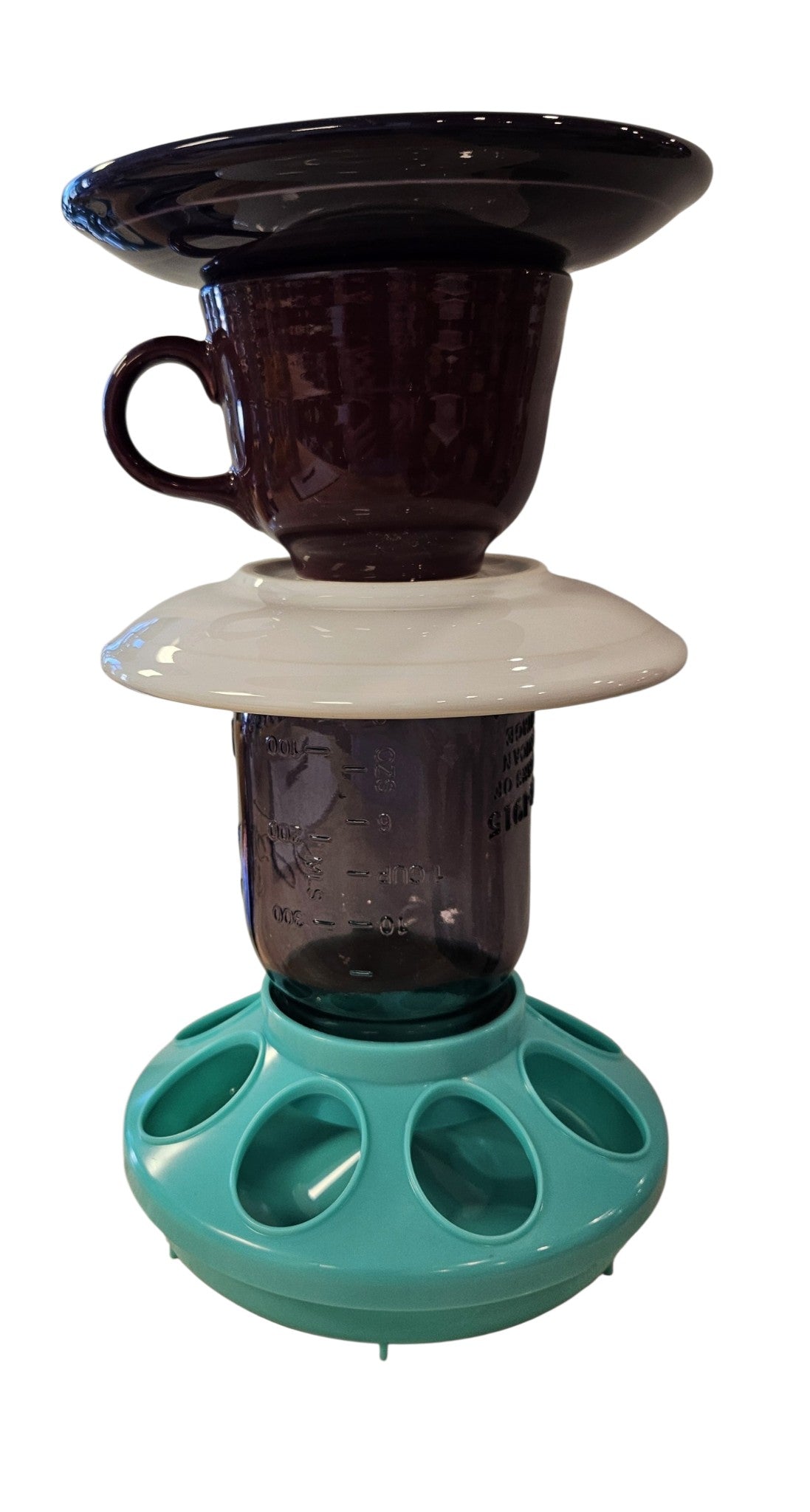 This is a handcrafted Birdfeeder made from a Fiesta Fiestware Cup and two saucers. It includes a glass jar to hold birdseed and either a plastic or metal base for the birds to land and feast. The top saucer is also perfect to hold grape jam or orange slices to feed your local orioles. Please see item description for specific cup and saucer color, jar color and base type. Crafted, Fiesta Second Life
