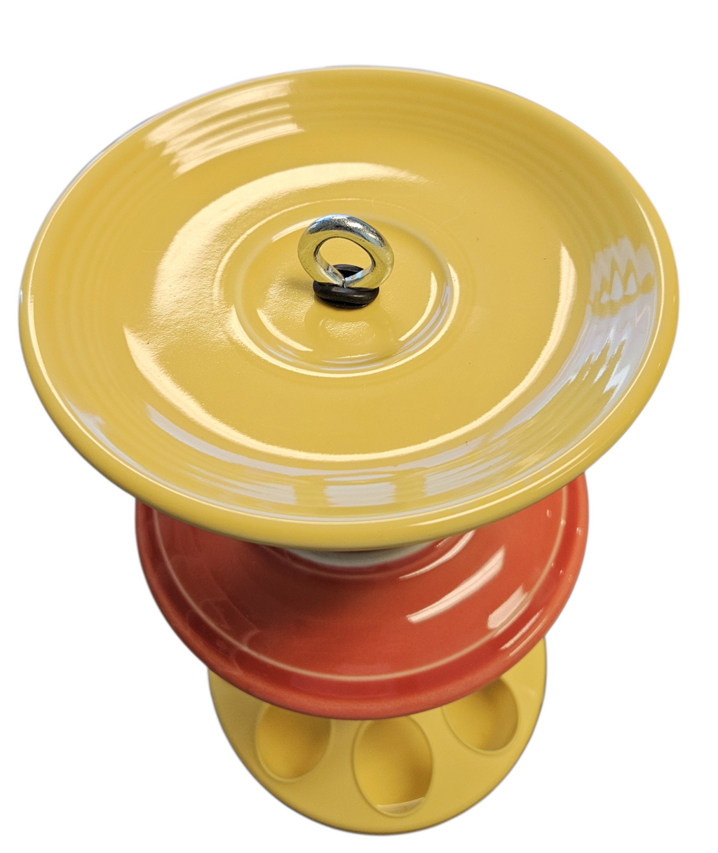 This is a handcrafted Birdfeeder made from a Fiesta Fiestware Cup and two saucers. It includes a glass jar to hold birdseed and either a plastic or metal base for the birds to land and feast. The top saucer is also perfect to hold grape jam or orange slices to feed your local orioles. Please see item description for specific cup and saucer color, jar color and base type. Crafted, Fiesta Second Life
