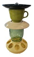 This is a handcrafted Birdfeeder made from a Fiesta Fiestware Cup and two saucers. It includes a glass jar to hold birdseed and either a plastic or metal base for the birds to land and feast. The top saucer is also perfect to hold grape jam or orange slices to feed your local orioles. Please see item description for specific cup and saucer color, jar color and base type. Crafted, Fiesta Second Life
