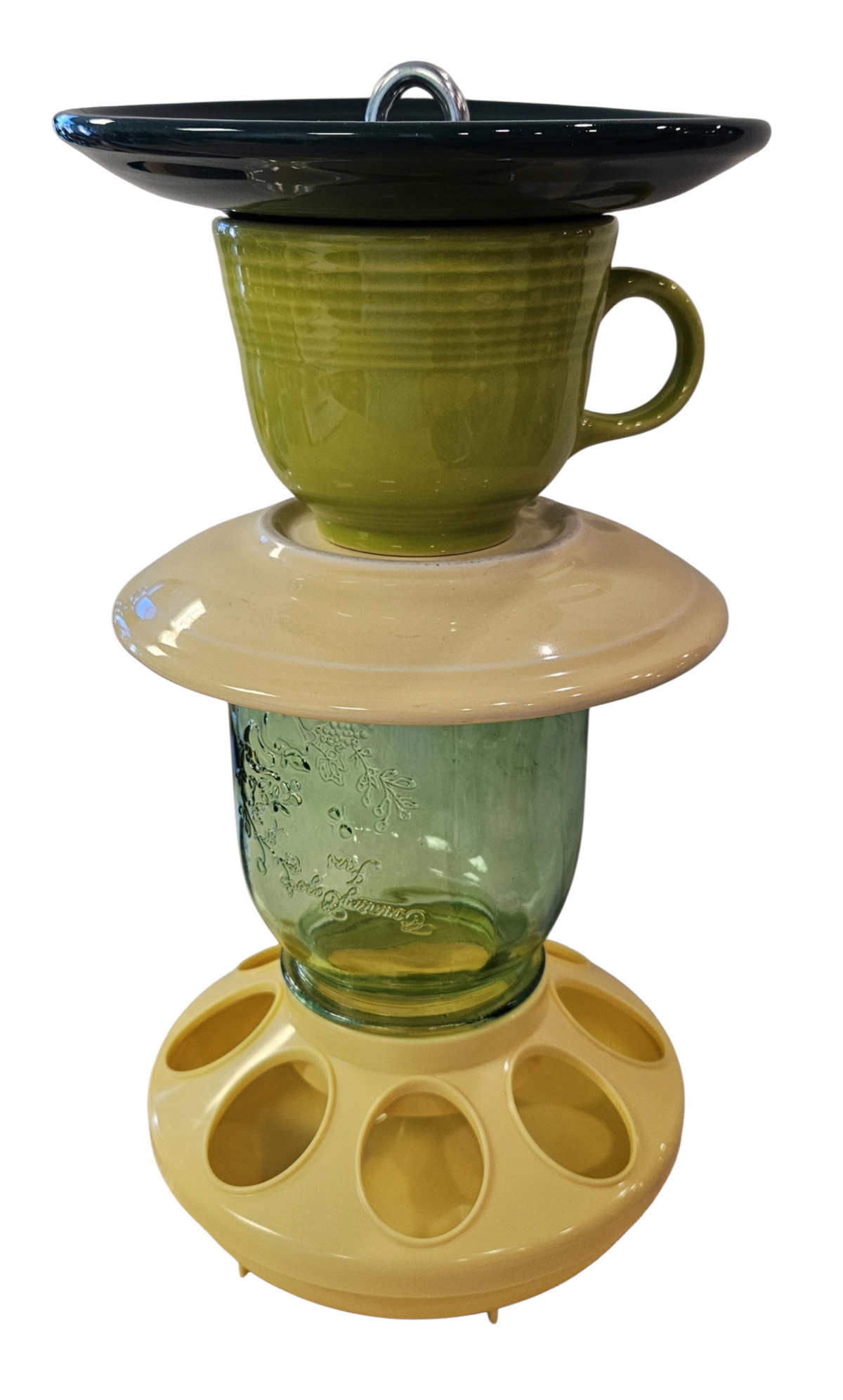 This is a handcrafted Birdfeeder made from a Fiesta Fiestware Cup and two saucers. It includes a glass jar to hold birdseed and either a plastic or metal base for the birds to land and feast. The top saucer is also perfect to hold grape jam or orange slices to feed your local orioles. Please see item description for specific cup and saucer color, jar color and base type. Crafted, Fiesta Second Life
