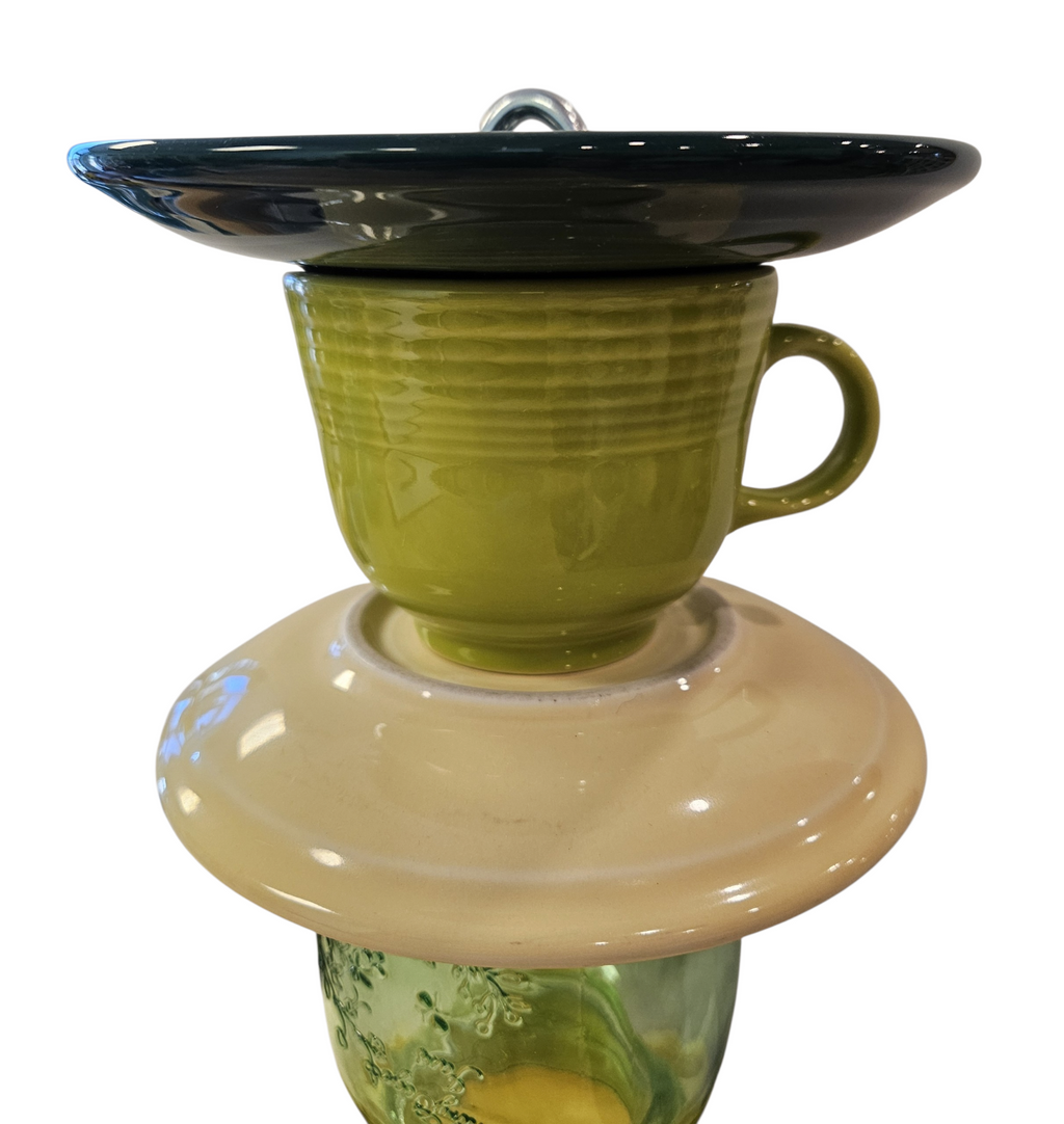 This is a handcrafted Birdfeeder made from a Fiesta Fiestware Cup and two saucers. It includes a glass jar to hold birdseed and either a plastic or metal base for the birds to land and feast. The top saucer is also perfect to hold grape jam or orange slices to feed your local orioles. Please see item description for specific cup and saucer color, jar color and base type. Crafted, Fiesta Second Life
