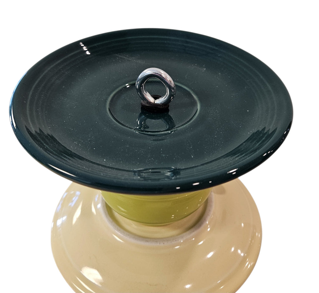 This is a handcrafted Birdfeeder made from a Fiesta Fiestware Cup and two saucers. It includes a glass jar to hold birdseed and either a plastic or metal base for the birds to land and feast. The top saucer is also perfect to hold grape jam or orange slices to feed your local orioles. Please see item description for specific cup and saucer color, jar color and base type. Crafted, Fiesta Second Life
