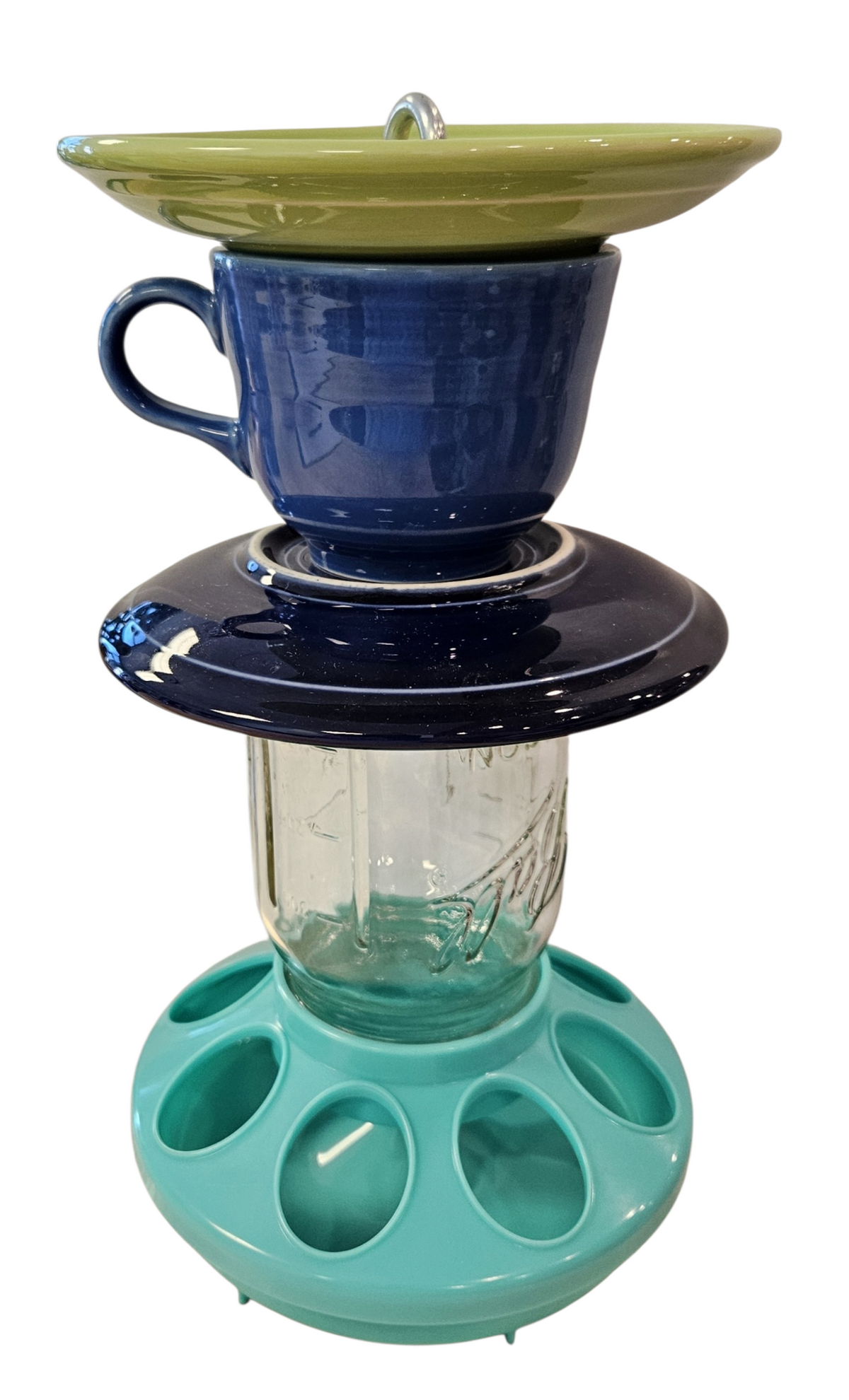 This is a handcrafted Birdfeeder made from a Fiesta Fiestware Cup and two saucers. It includes a glass jar to hold birdseed and either a plastic or metal base for the birds to land and feast. The top saucer is also perfect to hold grape jam or orange slices to feed your local orioles. Please see item description for specific cup and saucer color, jar color and base type. Crafted, Fiesta Second Life
