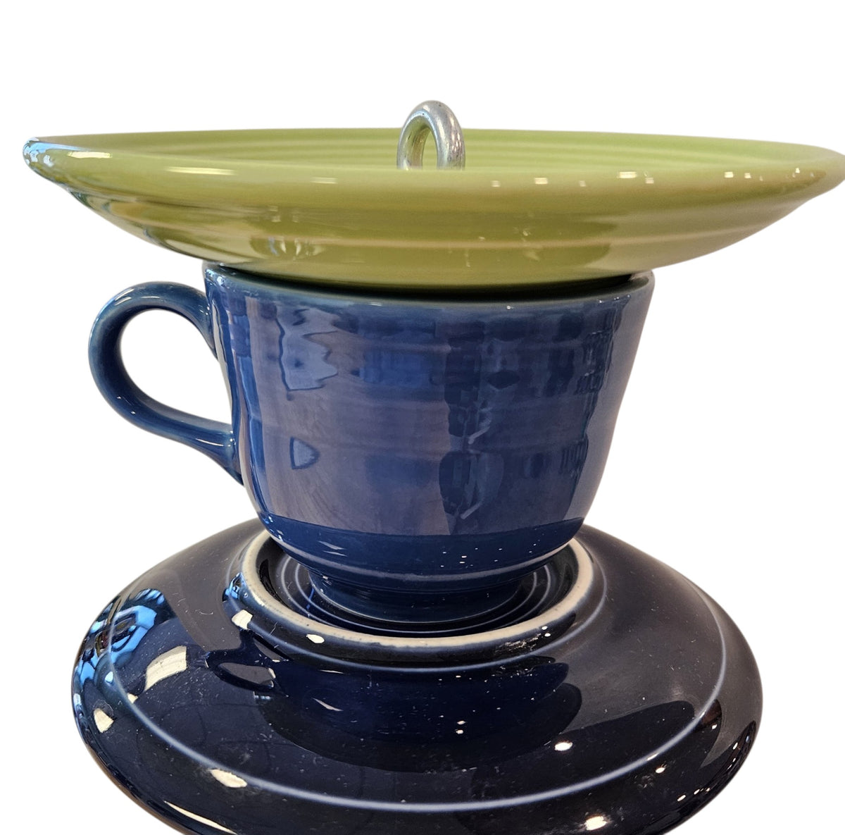 This is a handcrafted Birdfeeder made from a Fiesta Fiestware Cup and two saucers. It includes a glass jar to hold birdseed and either a plastic or metal base for the birds to land and feast. The top saucer is also perfect to hold grape jam or orange slices to feed your local orioles. Please see item description for specific cup and saucer color, jar color and base type. Crafted, Fiesta Second Life
