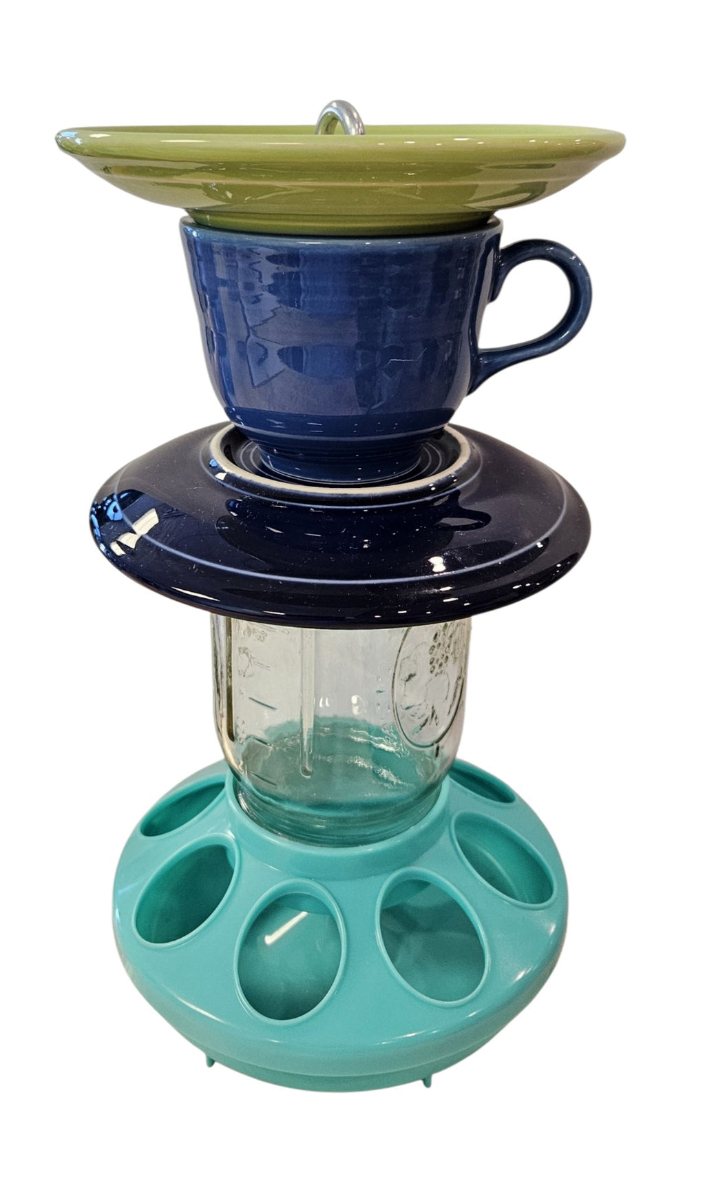 This is a handcrafted Birdfeeder made from a Fiesta Fiestware Cup and two saucers. It includes a glass jar to hold birdseed and either a plastic or metal base for the birds to land and feast. The top saucer is also perfect to hold grape jam or orange slices to feed your local orioles. Please see item description for specific cup and saucer color, jar color and base type. Crafted, Fiesta Second Life

