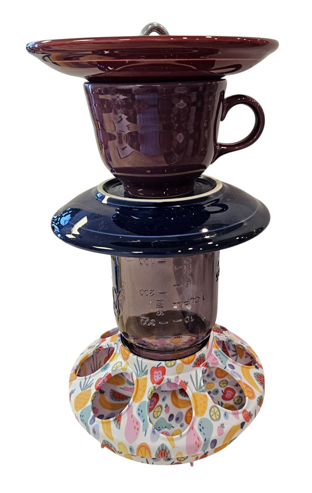 This is a handcrafted Birdfeeder made from a Fiesta Fiestware Cup and two saucers. It includes a glass jar to hold birdseed and either a plastic or metal base for the birds to land and feast. The top saucer is also perfect to hold grape jam or orange slices to feed your local orioles. Please see item description for specific cup and saucer color, jar color and base type. Crafted, Fiesta Second Life
