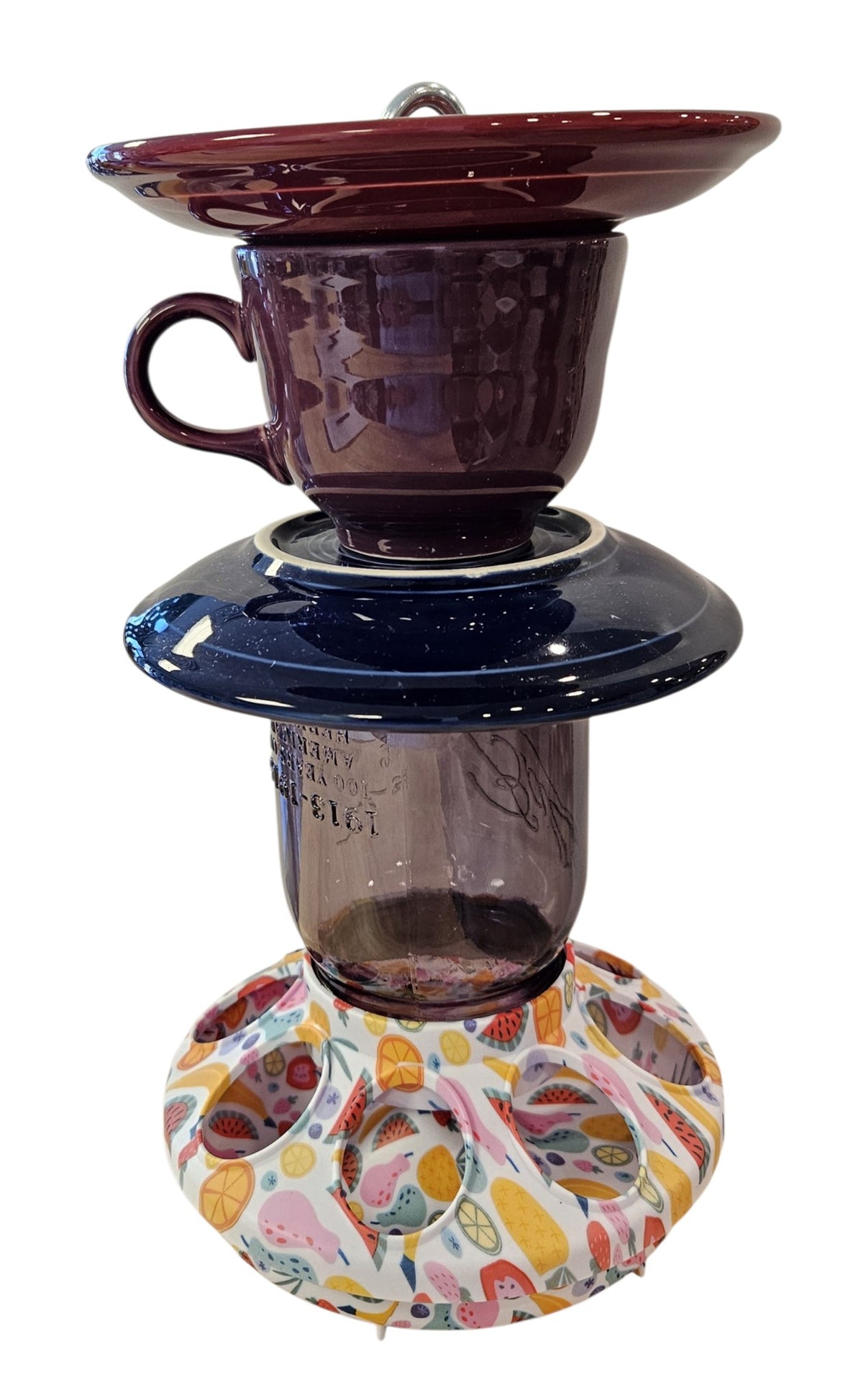 This is a handcrafted Birdfeeder made from a Fiesta Fiestware Cup and two saucers. It includes a glass jar to hold birdseed and either a plastic or metal base for the birds to land and feast. The top saucer is also perfect to hold grape jam or orange slices to feed your local orioles. Please see item description for specific cup and saucer color, jar color and base type. Crafted, Fiesta Second Life
