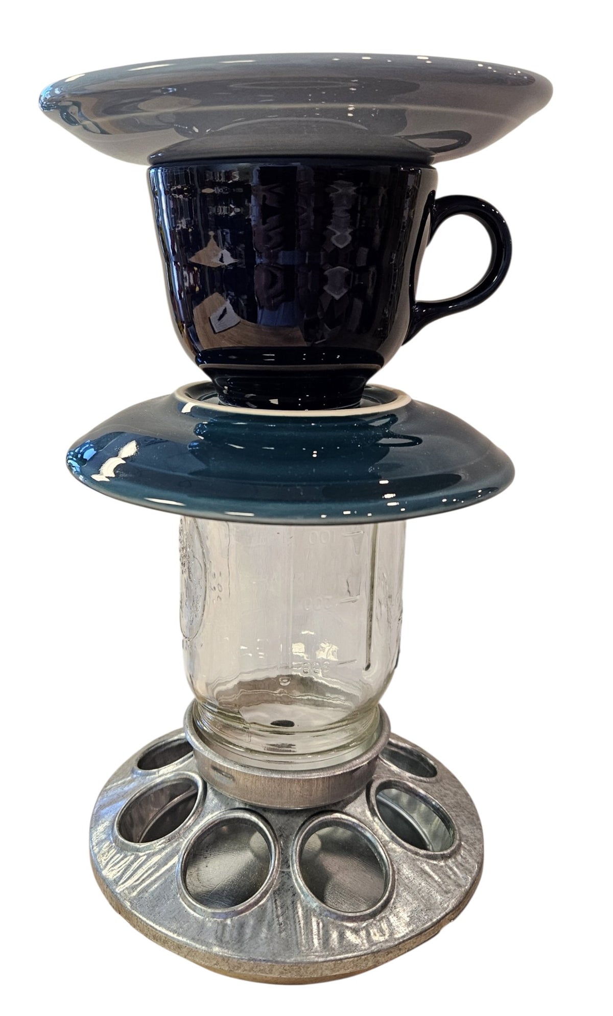 This is a handcrafted Birdfeeder made from a Fiesta Fiestware Cup and two saucers. It includes a glass jar to hold birdseed and either a plastic or metal base for the birds to land and feast. The top saucer is also perfect to hold grape jam or orange slices to feed your local orioles. Please see item description for specific cup and saucer color, jar color and base type. Crafted, Fiesta Second Life
