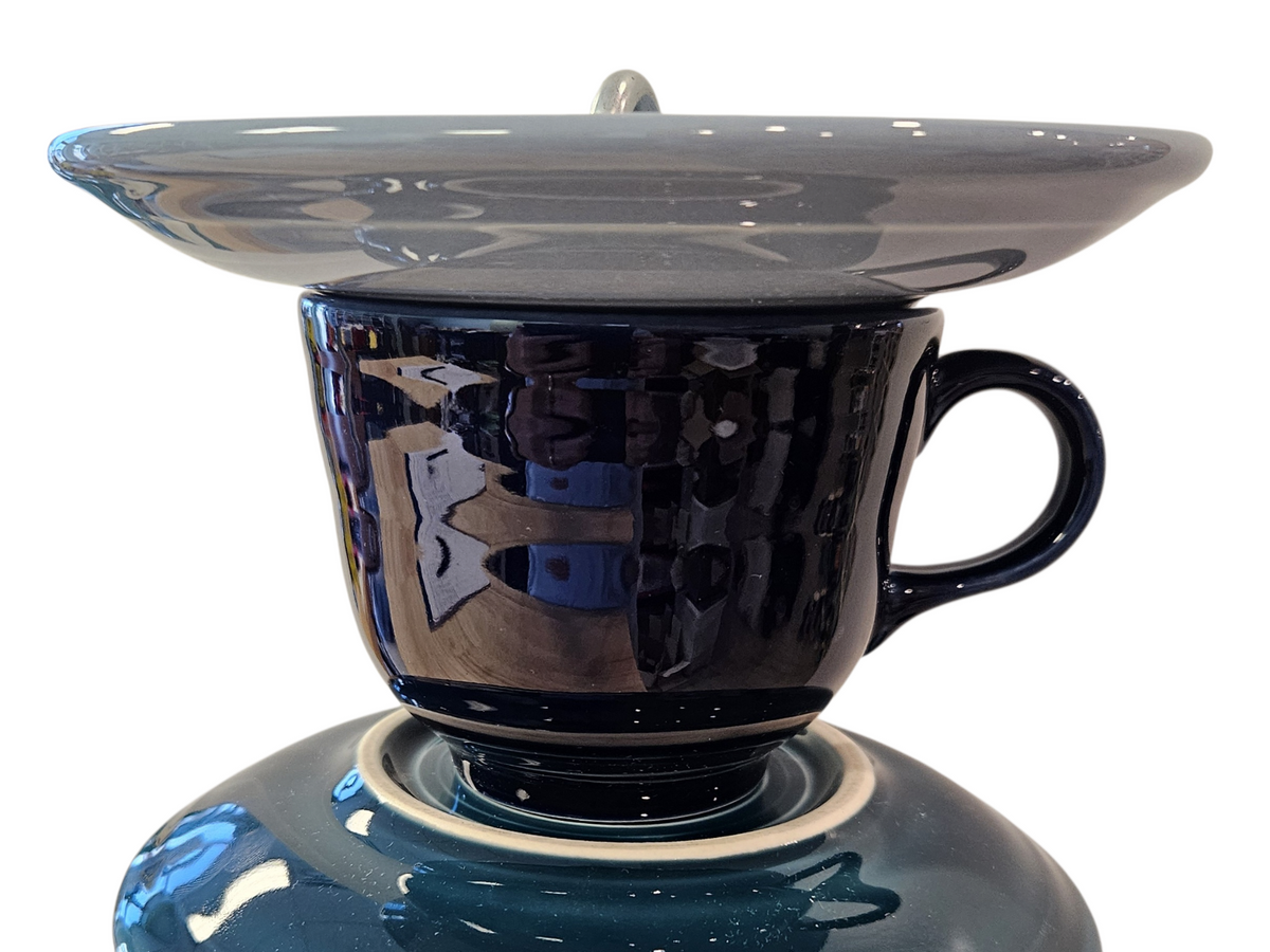 This is a handcrafted Birdfeeder made from a Fiesta Fiestware Cup and two saucers. It includes a glass jar to hold birdseed and either a plastic or metal base for the birds to land and feast. The top saucer is also perfect to hold grape jam or orange slices to feed your local orioles. Please see item description for specific cup and saucer color, jar color and base type. Crafted, Fiesta Second Life

