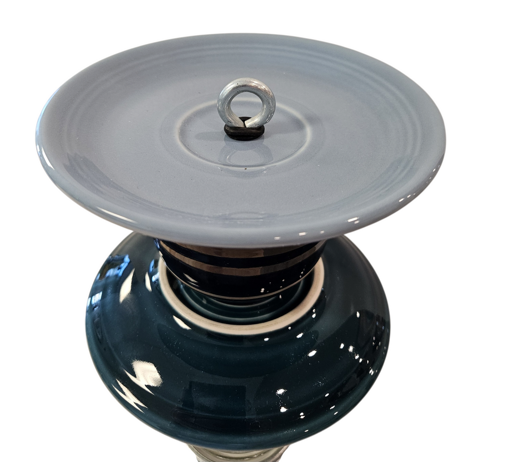 This is a handcrafted Birdfeeder made from a Fiesta Fiestware Cup and two saucers. It includes a glass jar to hold birdseed and either a plastic or metal base for the birds to land and feast. The top saucer is also perfect to hold grape jam or orange slices to feed your local orioles. Please see item description for specific cup and saucer color, jar color and base type. Crafted, Fiesta Second Life
