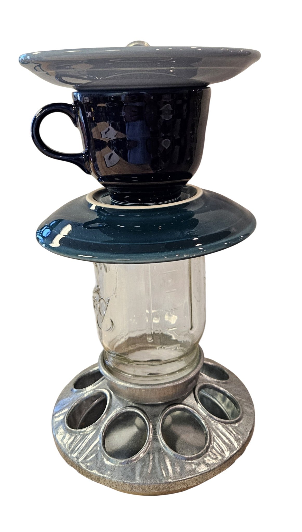 This is a handcrafted Birdfeeder made from a Fiesta Fiestware Cup and two saucers. It includes a glass jar to hold birdseed and either a plastic or metal base for the birds to land and feast. The top saucer is also perfect to hold grape jam or orange slices to feed your local orioles. Please see item description for specific cup and saucer color, jar color and base type. Crafted, Fiesta Second Life
