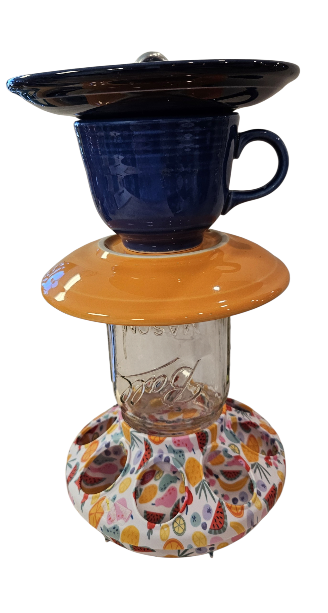 This is a handcrafted Birdfeeder made from a Fiesta Fiestware Cup and two saucers. It includes a glass jar to hold birdseed and either a plastic or metal base for the birds to land and feast. The top saucer is also perfect to hold grape jam or orange slices to feed your local orioles. Please see item description for specific cup and saucer color, jar color and base type. Crafted, Fiesta Second Life
