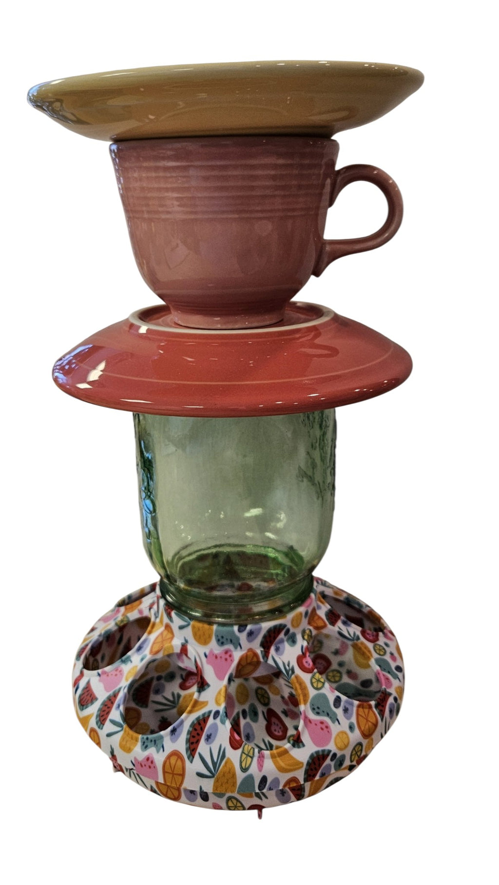 This is a handcrafted Birdfeeder made from a Fiesta Fiestware Cup and two saucers. It includes a glass jar to hold birdseed and either a plastic or metal base for the birds to land and feast. The top saucer is also perfect to hold grape jam or orange slices to feed your local orioles. Please see item description for specific cup and saucer color, jar color and base type. Crafted, Fiesta Second Life
