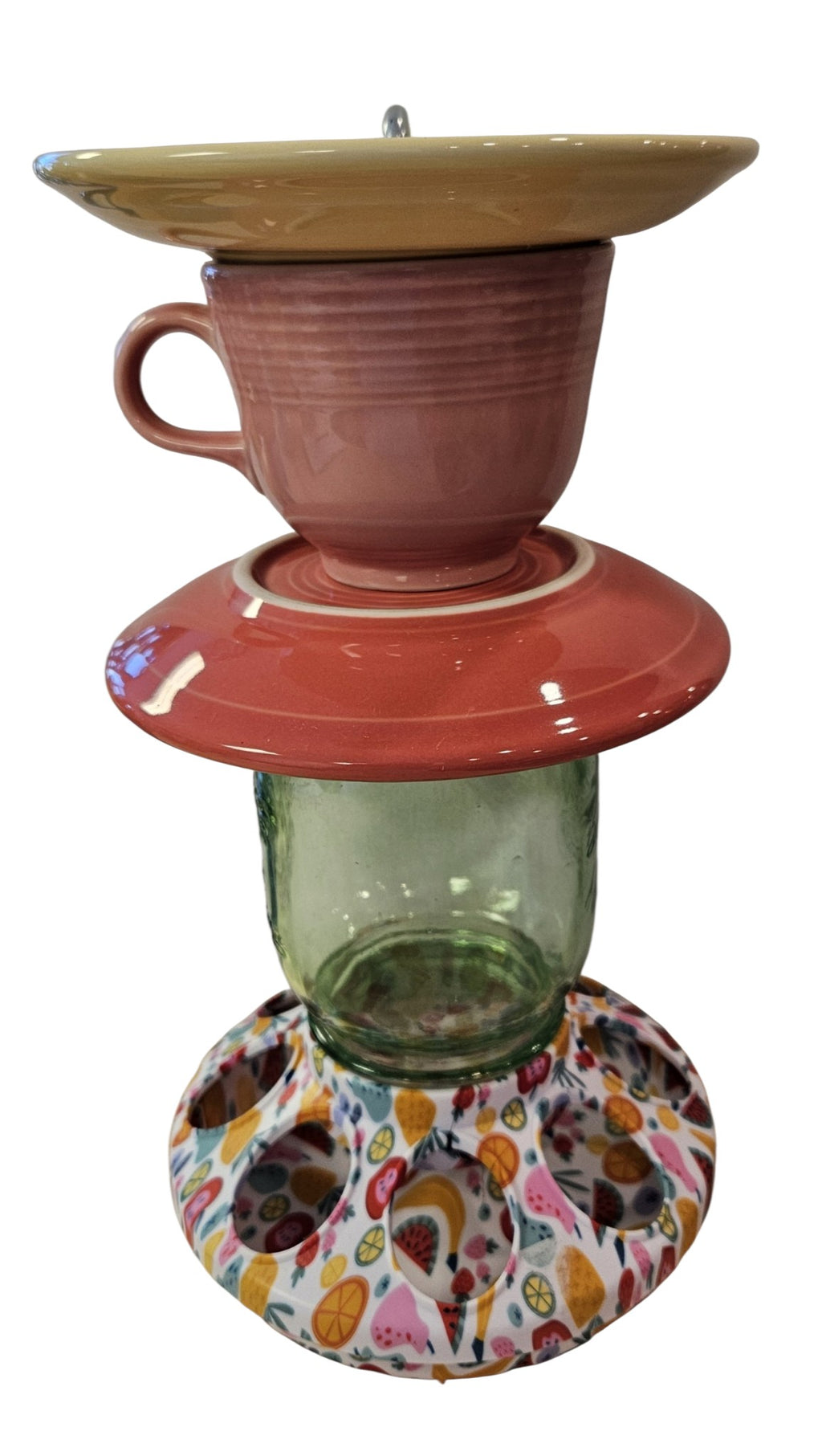 This is a handcrafted Birdfeeder made from a Fiesta Fiestware Cup and two saucers. It includes a glass jar to hold birdseed and either a plastic or metal base for the birds to land and feast. The top saucer is also perfect to hold grape jam or orange slices to feed your local orioles. Please see item description for specific cup and saucer color, jar color and base type. Crafted, Fiesta Second Life
