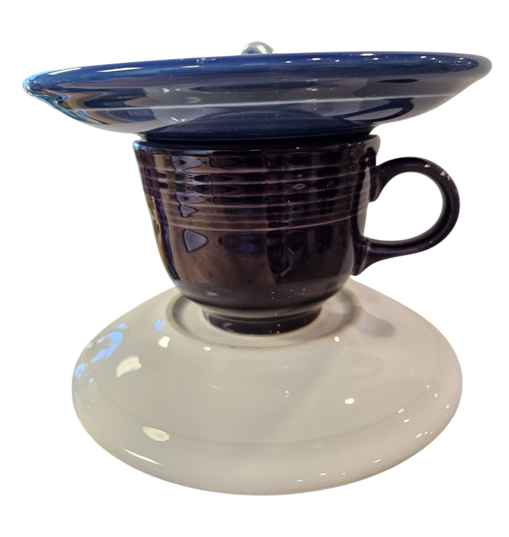 This is a handcrafted Birdfeeder made from a Fiesta Fiestware Cup and two saucers. It includes a glass jar to hold birdseed and either a plastic or metal base for the birds to land and feast. The top saucer is also perfect to hold grape jam or orange slices to feed your local orioles. Please see item description for specific cup and saucer color, jar color and base type. Crafted, Fiesta Second Life
