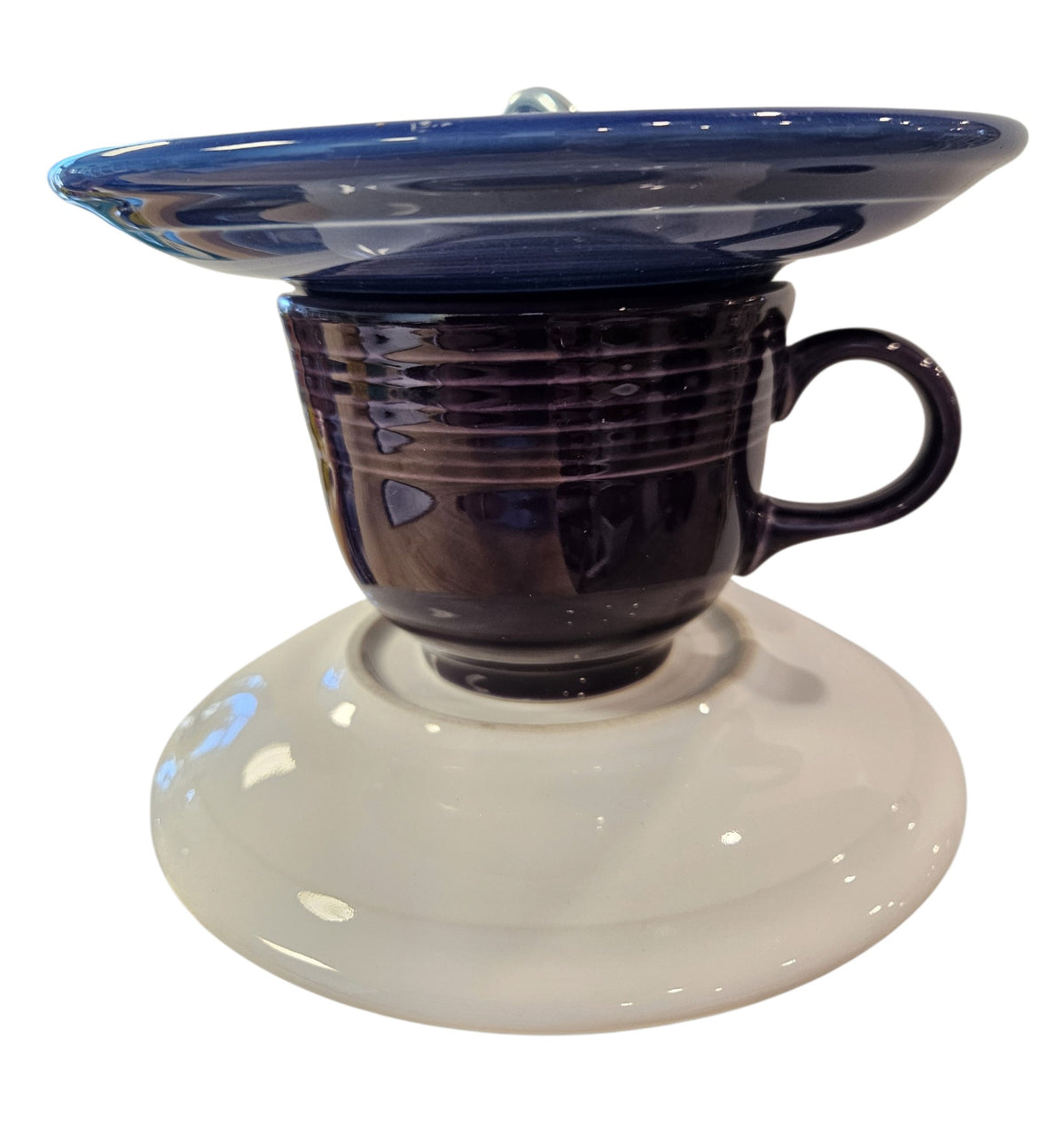 This is a handcrafted Birdfeeder made from a Fiesta Fiestware Cup and two saucers. It includes a glass jar to hold birdseed and either a plastic or metal base for the birds to land and feast. The top saucer is also perfect to hold grape jam or orange slices to feed your local orioles. Please see item description for specific cup and saucer color, jar color and base type. Crafted, Fiesta Second Life
