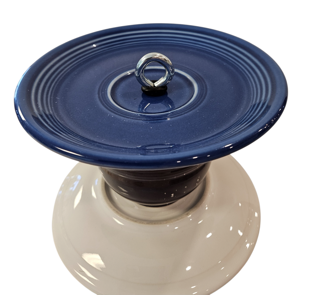 This is a handcrafted Birdfeeder made from a Fiesta Fiestware Cup and two saucers. It includes a glass jar to hold birdseed and either a plastic or metal base for the birds to land and feast. The top saucer is also perfect to hold grape jam or orange slices to feed your local orioles. Please see item description for specific cup and saucer color, jar color and base type. Crafted, Fiesta Second Life
