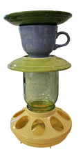 This is a handcrafted Birdfeeder made from a Fiesta Fiestware Cup and two saucers. It includes a glass jar to hold birdseed and either a plastic or metal base for the birds to land and feast. The top saucer is also perfect to hold grape jam or orange slices to feed your local orioles. Please see item description for specific cup and saucer color, jar color and base type. Crafted, Fiesta Second Life
